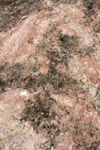 Detailed view of a granite rock surface showcasing natural textures and patterns.