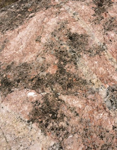 pexels-photo-30461343-30461343 Detailed view of a granite rock surface showcasing natural textures and patterns.